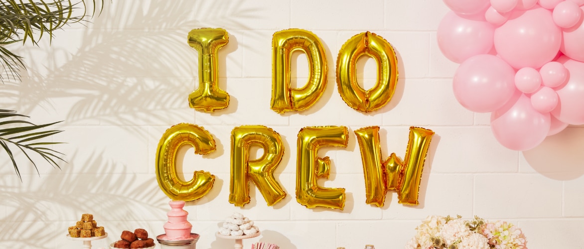 Gold letter balloons that read 'I DO CREW'.