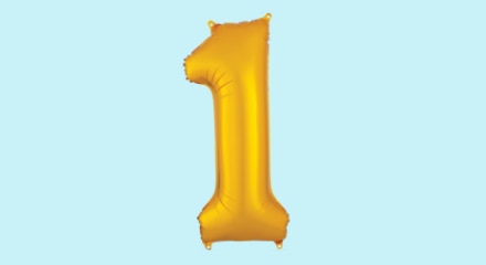 A gold number 1-shaped balloon.