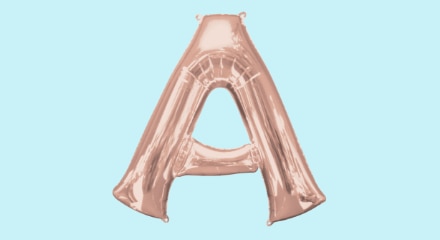 A rose gold coloured letter A balloon.