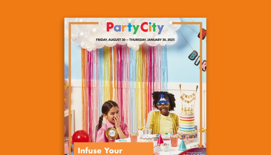 Two kids sitting at a table decorated for a birthday party.