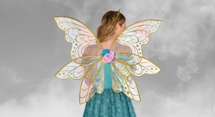 A woman wearing pastel-coloured fairy wings.