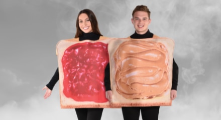 A man and woman wearing a peanut butter and jam couples costume.