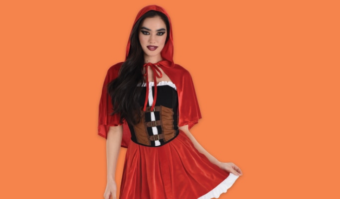 A woman wearing a red riding hood costume. 