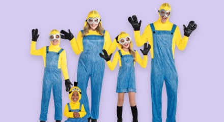 A man, woman and three kids wearing Minions costumes.