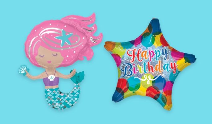 An inflatable mermaid balloon beside a multi-coloured balloon with the words 'Happy Birthday' printed on the front.