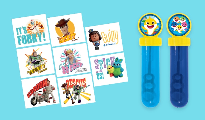 A pack of assorted Toy Story stickers beside shark-themed bubble blowers.