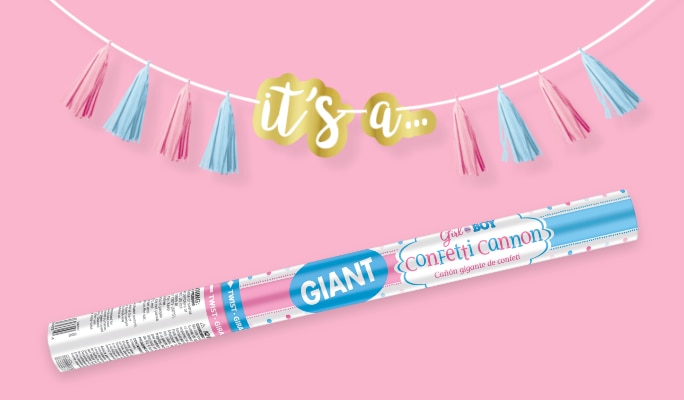 A confetti cannon and a pink and blue banner that reads 'it's a...'.