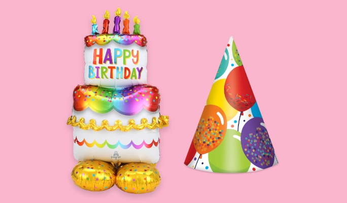 A birthday cake-shaped balloon and a birthday party hat.