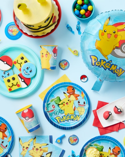 An overhead shot of a table dressed for a Pokémon-themed party.