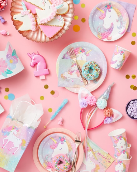 An overhead shot of a table dressed for a unicorn-themed party.