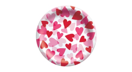 A white paper plate with red and pink hearts printed on the front.