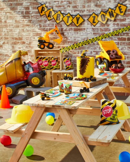 An overhead shot of a table dressed for a construction-themed party.