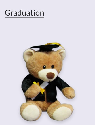 A teddy bear in a graduation cap and gown holding a diploma.