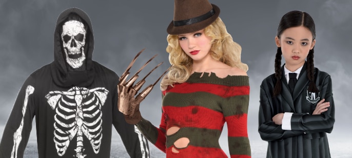 Three children in Halloween costumes: a skeleton, Wednesday Addams, and Freddy Krueger.