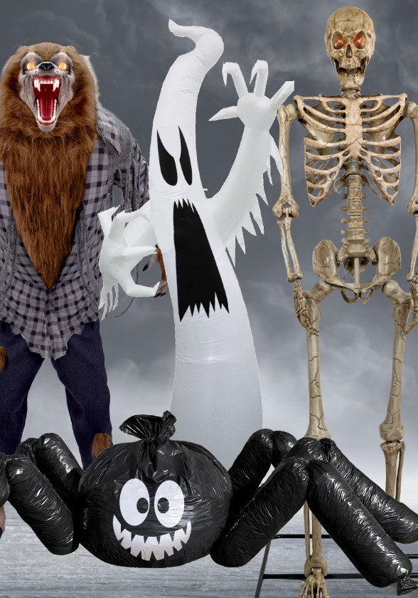 A group of Halloween decorations: a werewolf, a ghost, a skeleton, and an inflatable spider.