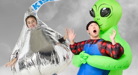 Two inflatable costumes: a Minion and a person being abducted by an alien.