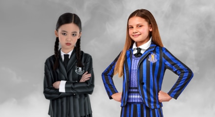 Two children dressed as Wednesday and Enid from the TV series "Wednesday."