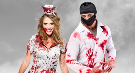 Two people in bloody Halloween costumes: a nurse and a doctor.
