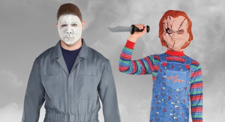 Two people in horror movie costumes: Michael Myers and Chucky.