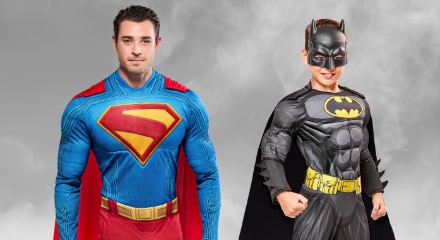 Two people in Superhero costumes: Superman and Batman.