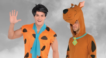 Two people in Halloween costumes: Fred Flinstone and Scooby Doo.