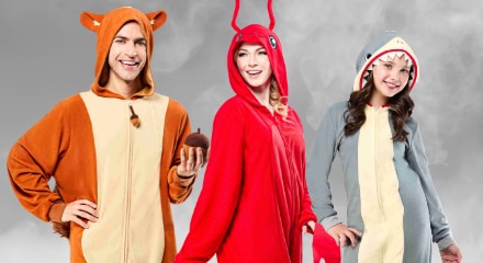 Three people in animal onesies: a squirrel,  a red lobster, and a shark.