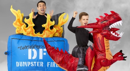 Two people in inflatable costumes: a dumpster fire outfit and a person riding a red dragon.