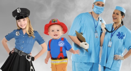 Four people in occupational costumes: a police officer, a firefighter, and two medical professionals.