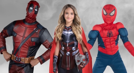 Three people dressed as superheroes: Deadpool, Thor, and Spider-Man.