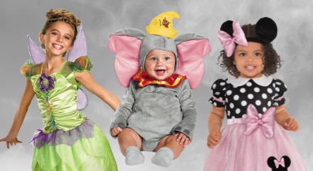 Three children in Disney-themed costumes: Tinker Bell, Dumbo, and Minnie Mouse.