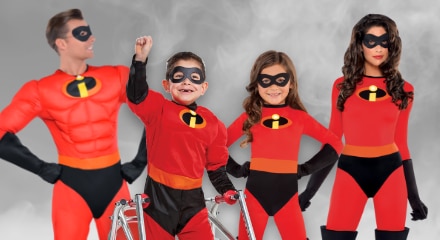 Four people dressed as The Incredibles in red superhero costumes.