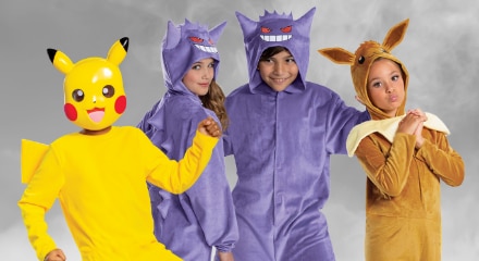 Four people dressed in Pokémon costumes: Pikachu, two Gengars, and Eevee.