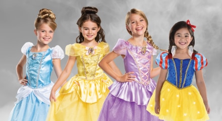 Four children dressed as Disney princesses: Cinderella, Belle, Rapunzel, and Snow White.