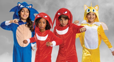 Four people dressed as characters from Sonic the Hedgehog: Sonic, two Knuckles, and Tails.