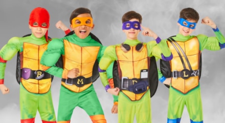 Four people dressed as Teenage Mutant Ninja Turtles: Raphael, Michelangelo, Donatello, and Leonardo.