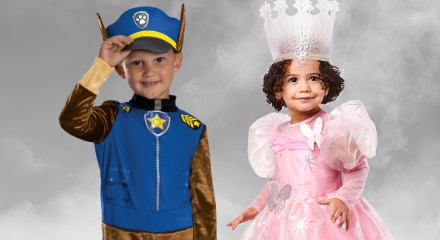Two children in Halloween costumes: a police officer and a princess.