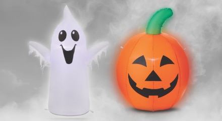 Inflatable Halloween decorations: a ghost and a jack-o'-lantern.