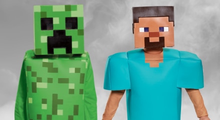 Two people in Minecraft costumes: Creeper and Steve.