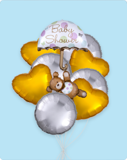 Baby shower balloons with a teddy bear and heart shapes.