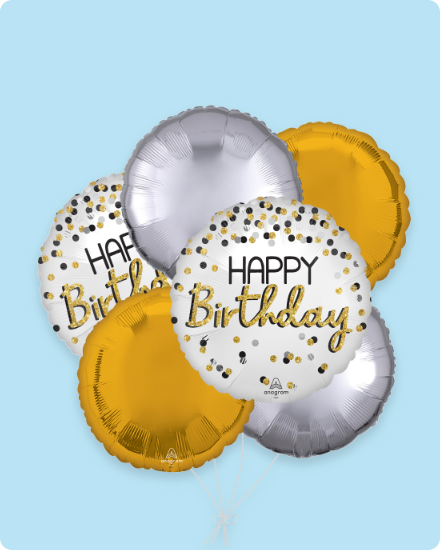 Gold and silver 'Happy Birthday' balloons.