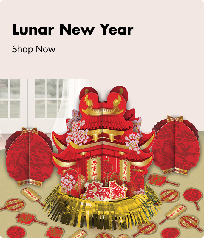 An array of red and gold Lunar New Year decorations and party favours sitting on a table. 