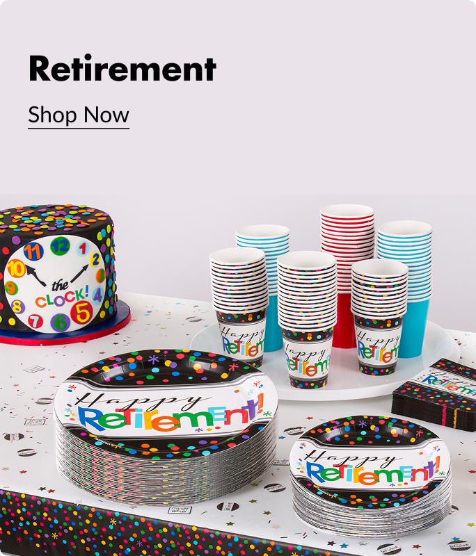A black and multi-coloured cake with a clock on it sitting next to black and multi-coloured cups and party plates that say 'Happy Retirement' on the front. 